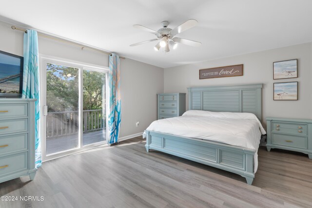 bathroom with hardwood / wood-style flooring, vanity, toilet, and separate washer and dryer