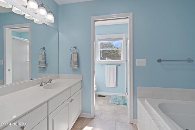 clothes washing area featuring cabinets and independent washer and dryer