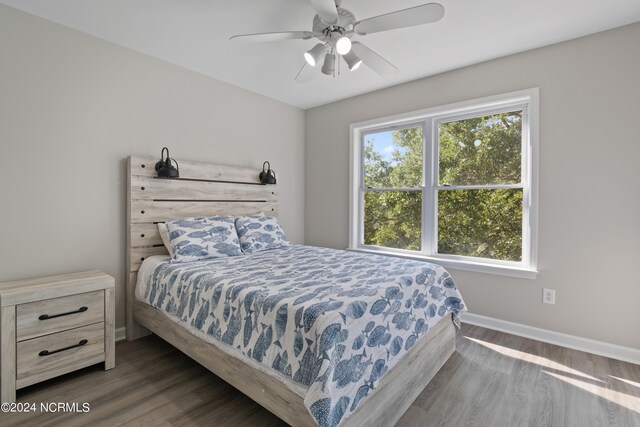 bedroom with access to exterior, ceiling fan, and light hardwood / wood-style floors