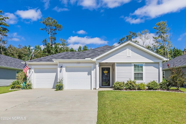 single story home featuring a front yard and a garage