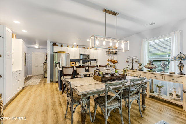 dining room featuring light hardwood / wood-style flooring