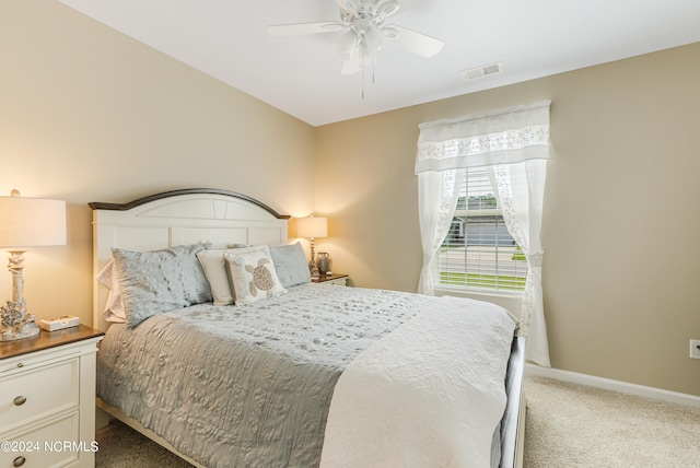 bedroom with ceiling fan and carpet