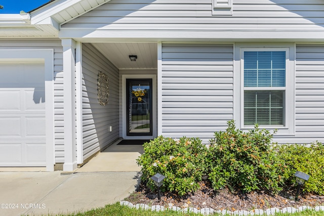 property entrance featuring a garage