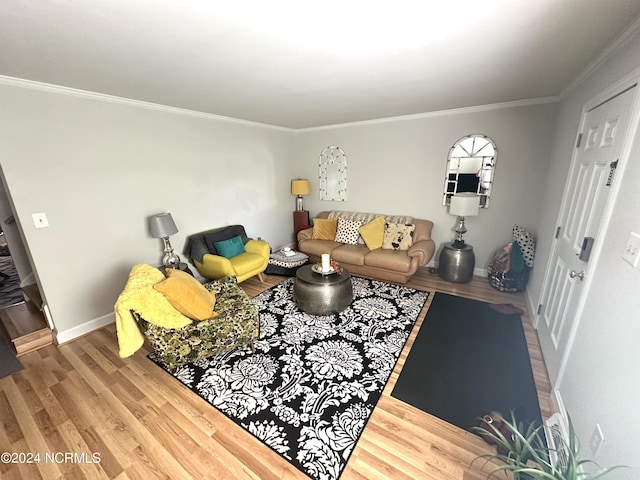 living room with ornamental molding and hardwood / wood-style flooring