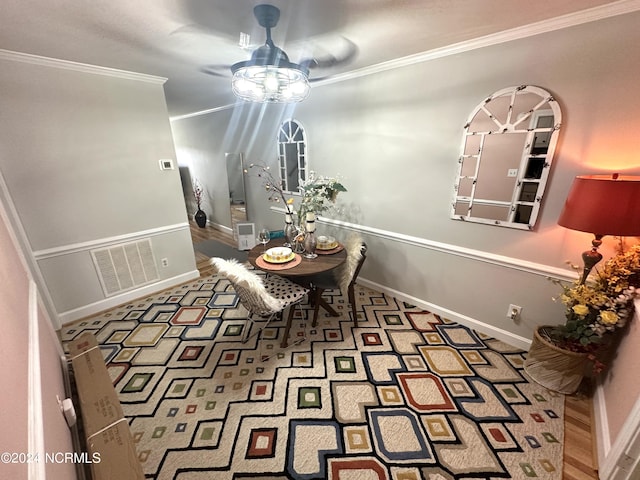 dining area featuring crown molding