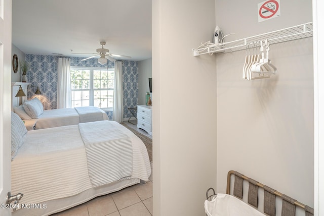 bedroom featuring ceiling fan and light tile patterned floors