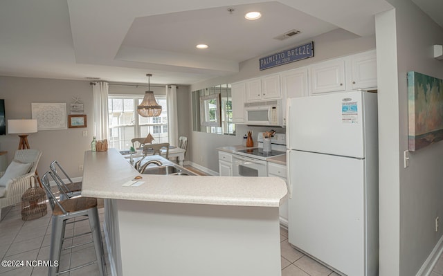 kitchen with hanging light fixtures, white cabinetry, white appliances, light tile patterned floors, and a center island