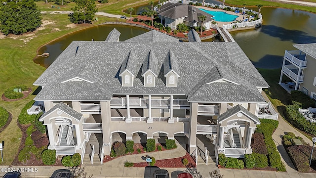 birds eye view of property with a water view