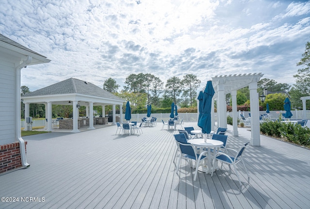 wooden terrace with a gazebo and a pergola