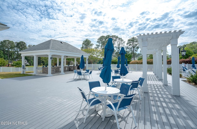 wooden deck with a gazebo and a pergola