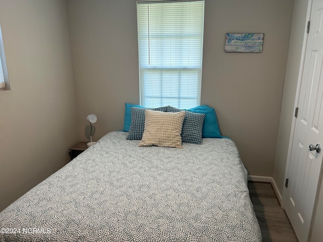 bedroom featuring hardwood / wood-style floors