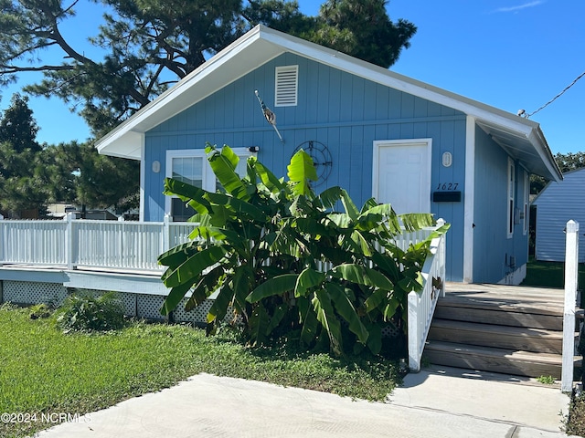 view of property exterior with a deck