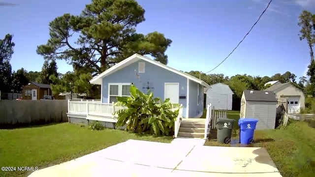 back of house with a lawn