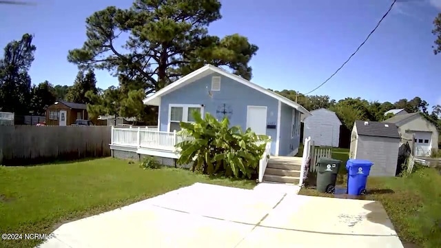 rear view of house featuring a lawn