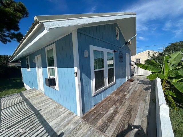 view of home's exterior featuring a wooden deck