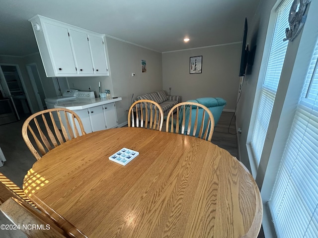 dining room featuring ornamental molding and separate washer and dryer