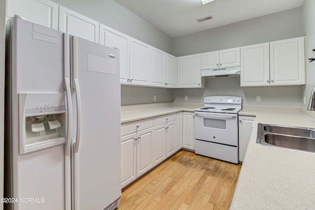 kitchen featuring white appliances, light hardwood / wood-style floors, white cabinetry, and sink