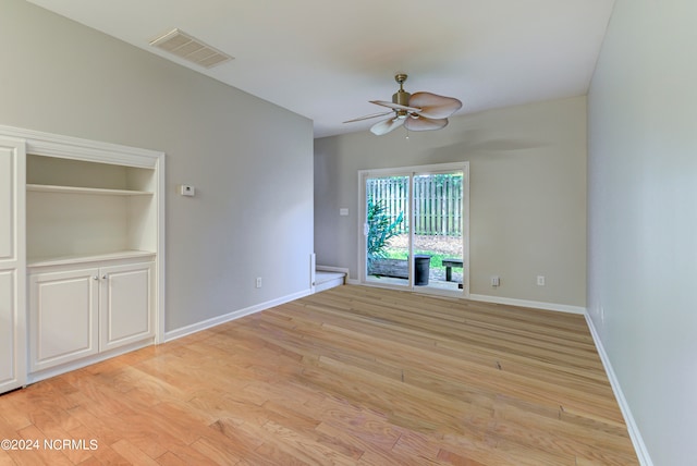 unfurnished room featuring light hardwood / wood-style flooring and ceiling fan