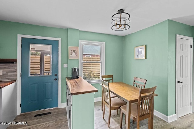 dining space with dark wood-type flooring