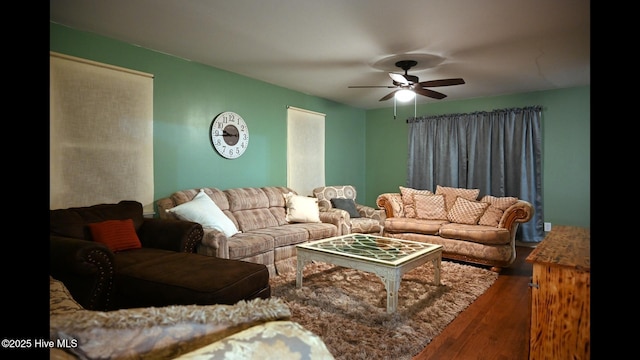 living room featuring hardwood / wood-style flooring and ceiling fan