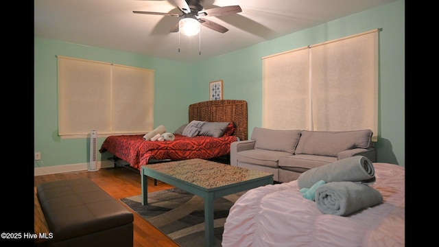 bedroom featuring hardwood / wood-style flooring and ceiling fan