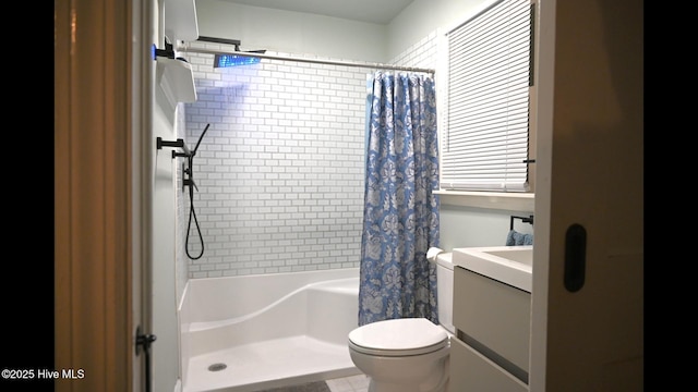 bathroom featuring walk in shower, vanity, and toilet