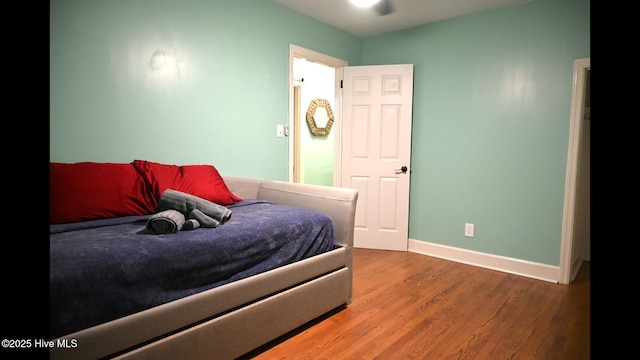 bedroom featuring hardwood / wood-style floors