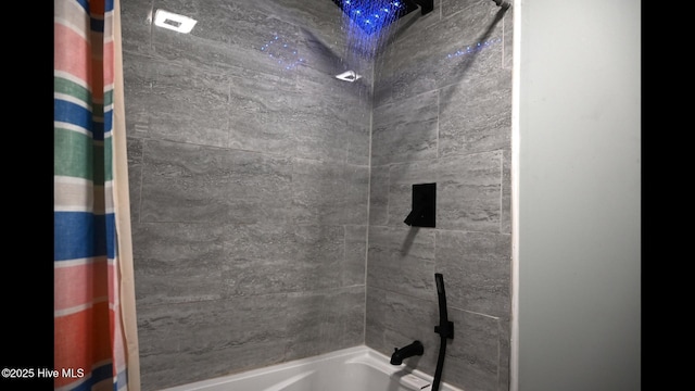 bathroom with shower / bath combination with curtain