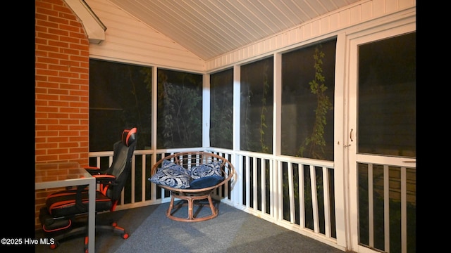 sunroom / solarium featuring vaulted ceiling