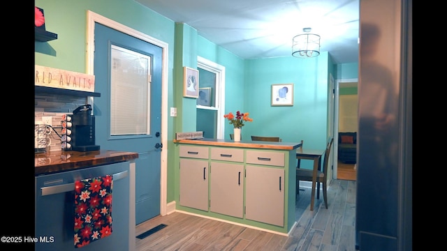 interior space with hardwood / wood-style flooring and beverage cooler