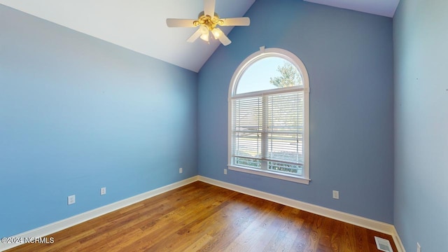 unfurnished room featuring wood-type flooring, lofted ceiling, and ceiling fan