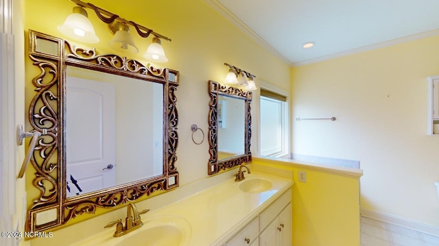 bathroom featuring ornamental molding and vanity