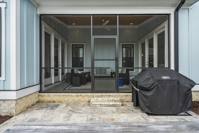 view of patio featuring ceiling fan, a sunroom, and a grill