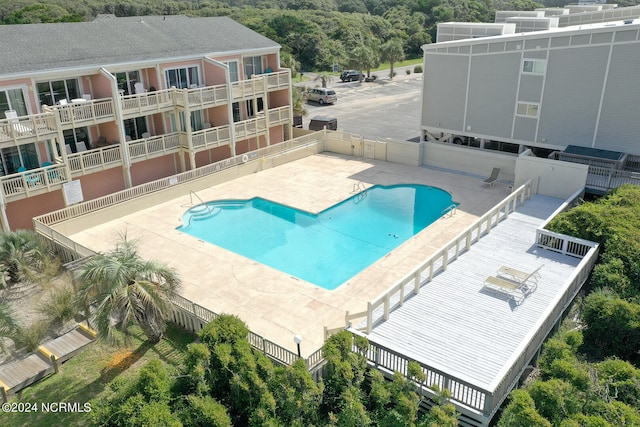 view of pool featuring a patio area