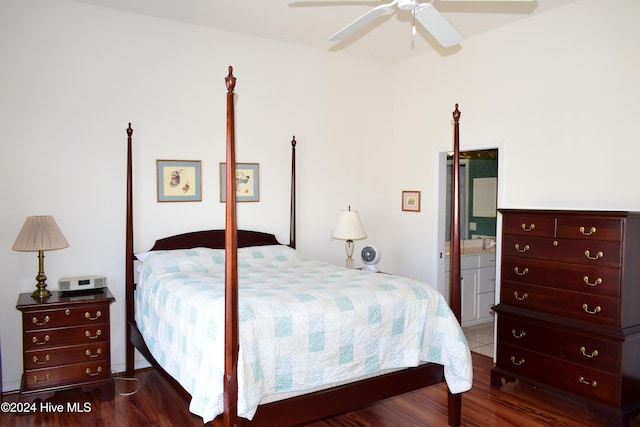 bedroom featuring ceiling fan, dark hardwood / wood-style flooring, and connected bathroom