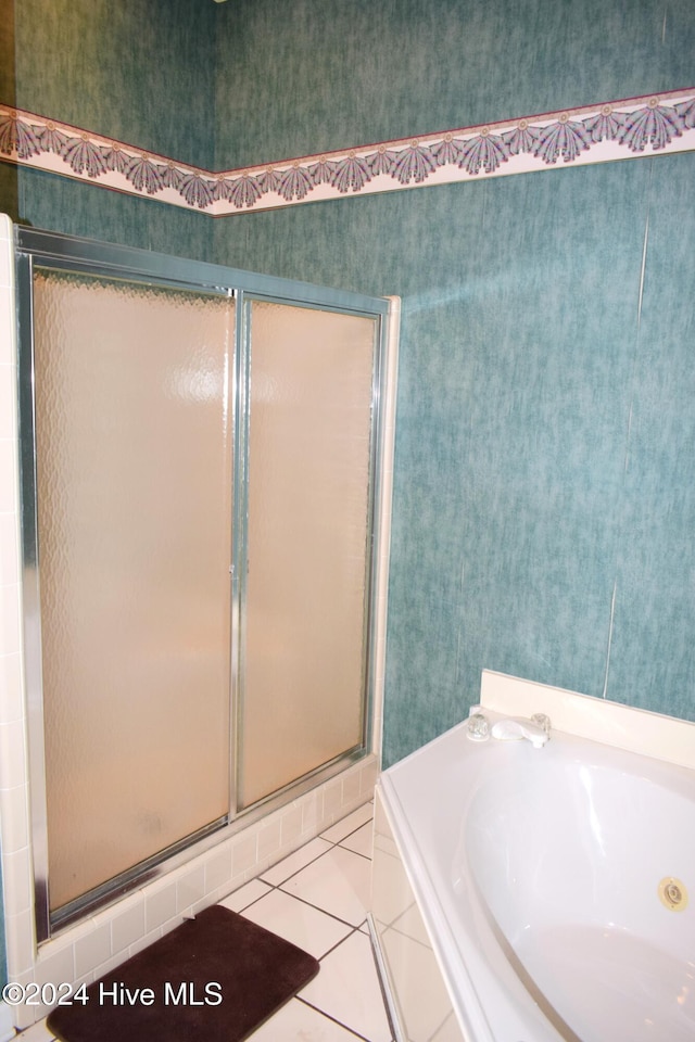 bathroom with tile patterned flooring and independent shower and bath