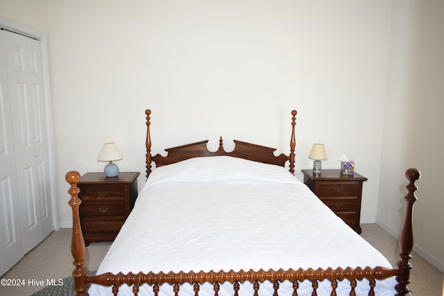 carpeted bedroom featuring a closet