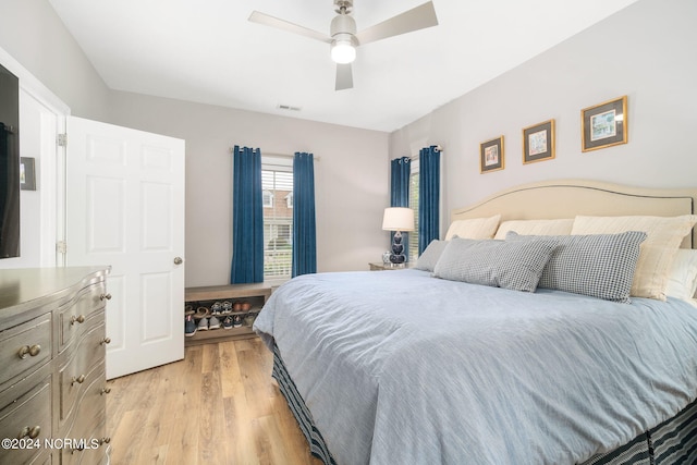 bedroom featuring ceiling fan and light hardwood / wood-style flooring