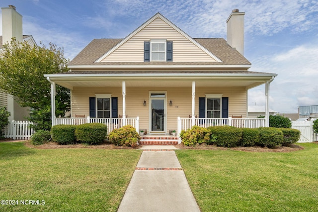 view of front facade with a front lawn and covered porch