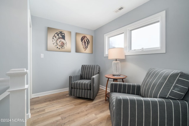 living area with light hardwood / wood-style floors