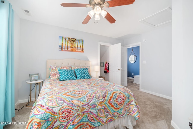 bedroom with ceiling fan and light colored carpet