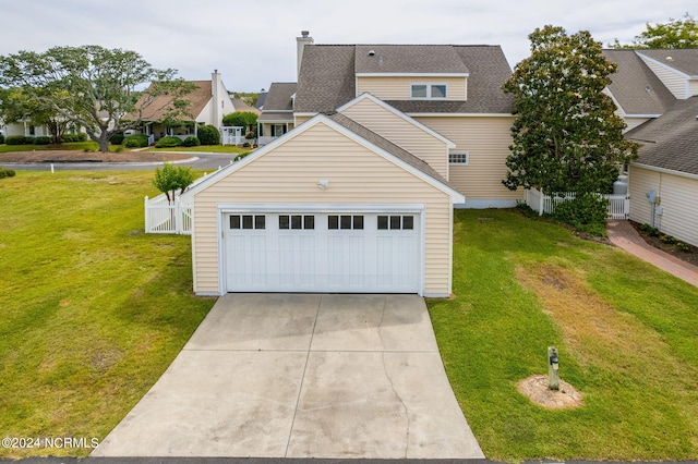 exterior space featuring a front yard and a garage