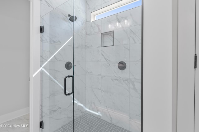 1655 Old Salt Run SW Unit L-45, Shallotte, NC 28470 - full bath featuring a shower stall and marble look tiles