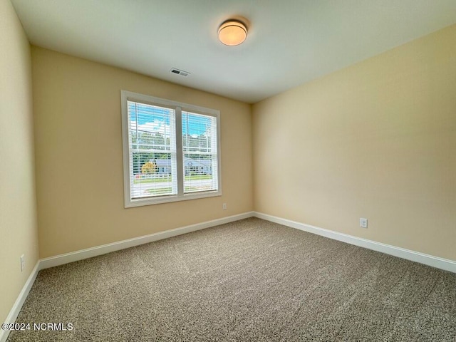 unfurnished room with carpet flooring