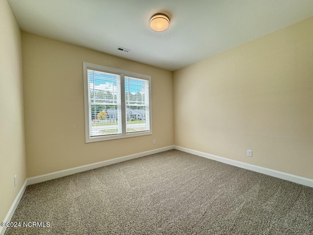 1005 Sunnybrook Rd S, Wilson, NC 27893 - carpeted empty room with baseboards