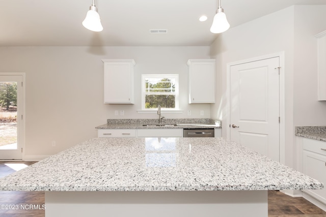 kitchen featuring decorative light fixtures, plenty of natural light, and sink