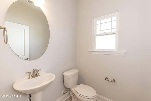 bathroom featuring sink and toilet