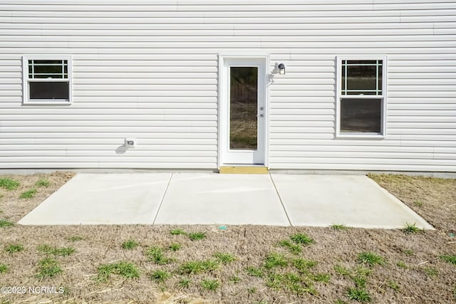 entrance to property with a patio