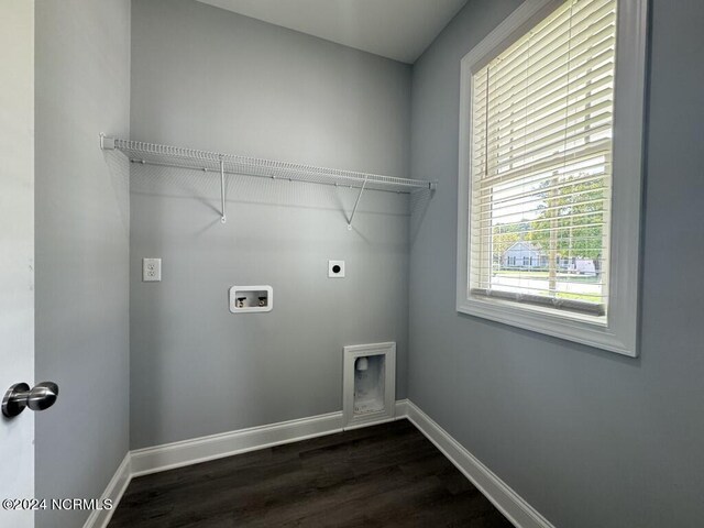 washroom with dark hardwood / wood-style floors, hookup for an electric dryer, and hookup for a washing machine