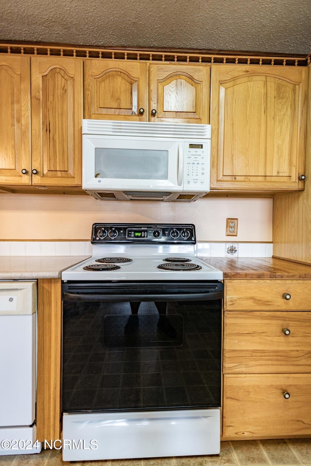 kitchen featuring white appliances